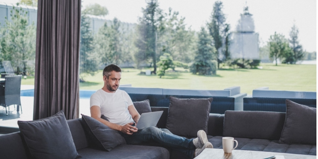 Man adopting flexible working practices by working from home