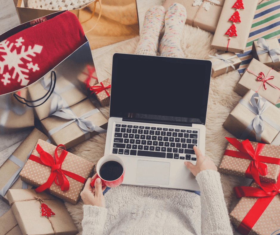 Lady using her laptop to complete all her Christmas preparations