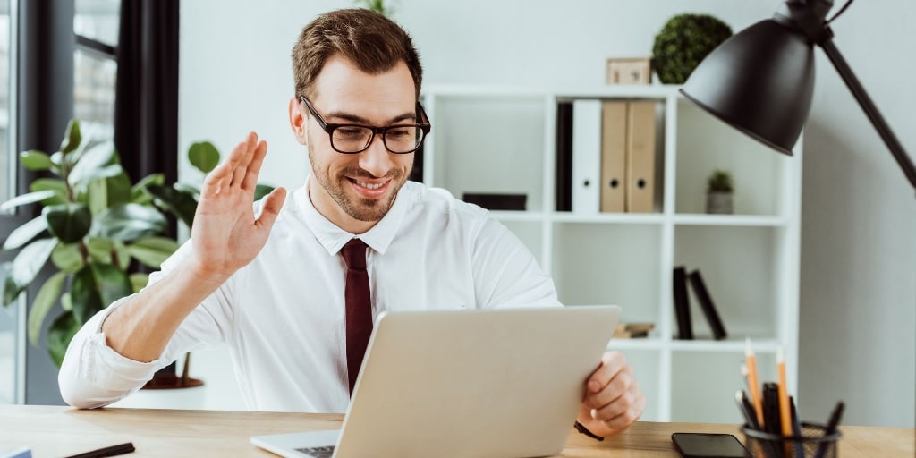 Man conducting a video call to avoid cancelling an interview