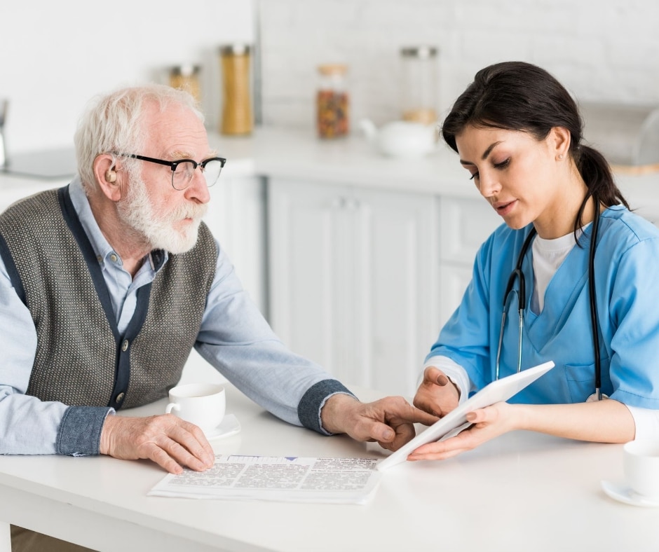 A nurse using technology to help her patient