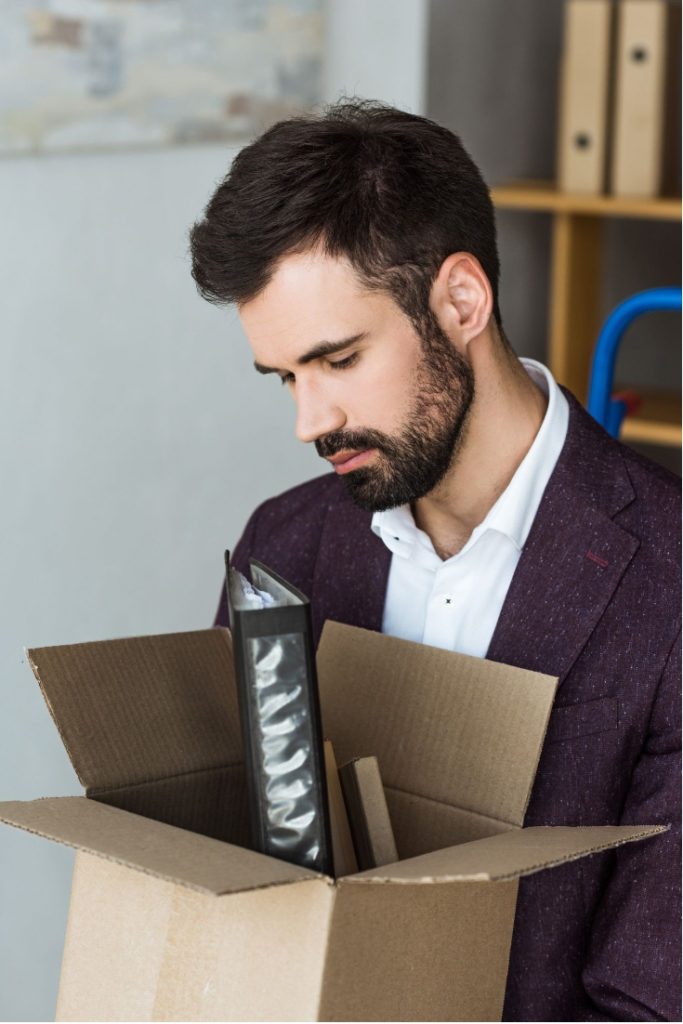 Sad looking man carrying his belongings out of an office. Redundancy is one of the situations where we realise exactly why experience is so important