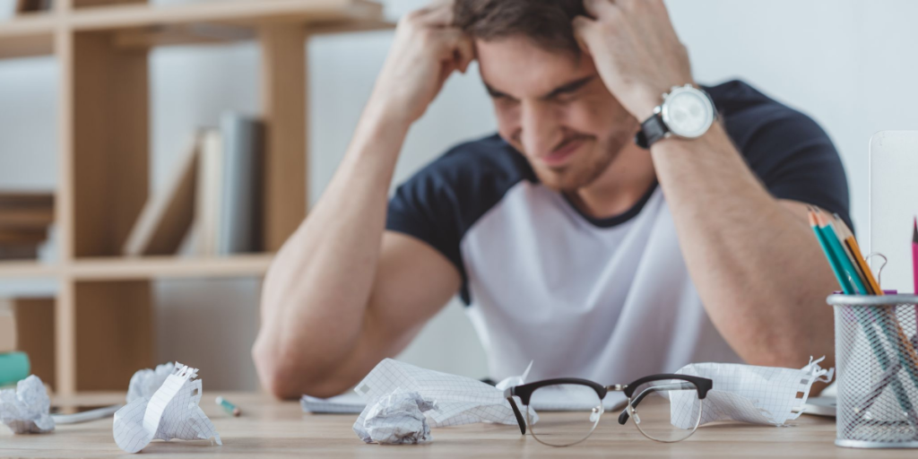 Young man feeling frustration of inability to get a job with no experience