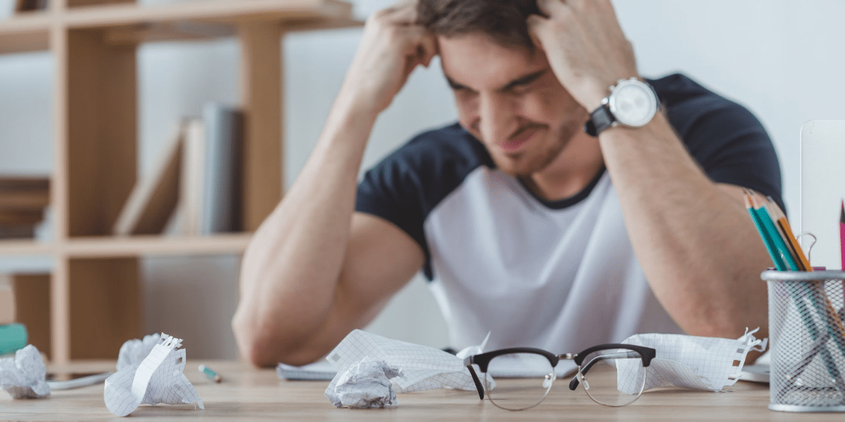 Young man feeling the frustration of not being able to get a job because he has no experience