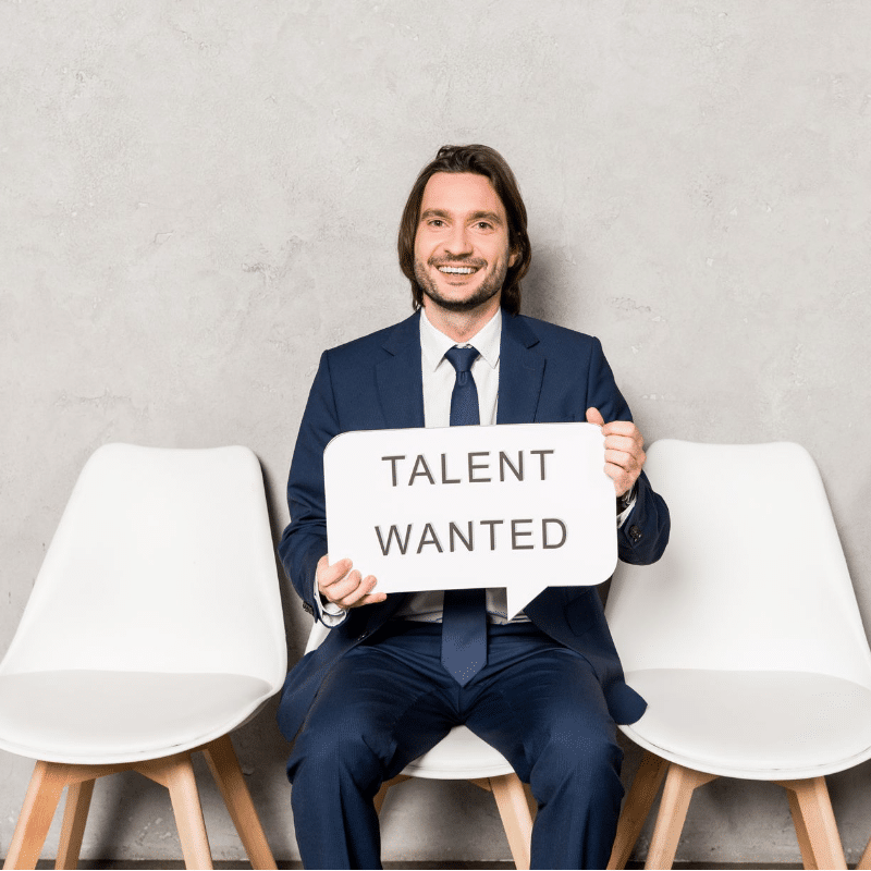 Can small businesses find the right talent? Yes, if they use better tactics than this man holding a sign saying talent wanted!