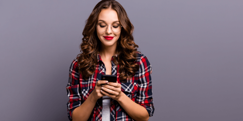 Happy candidate scrolling through social media feeds of her favourite recruiters