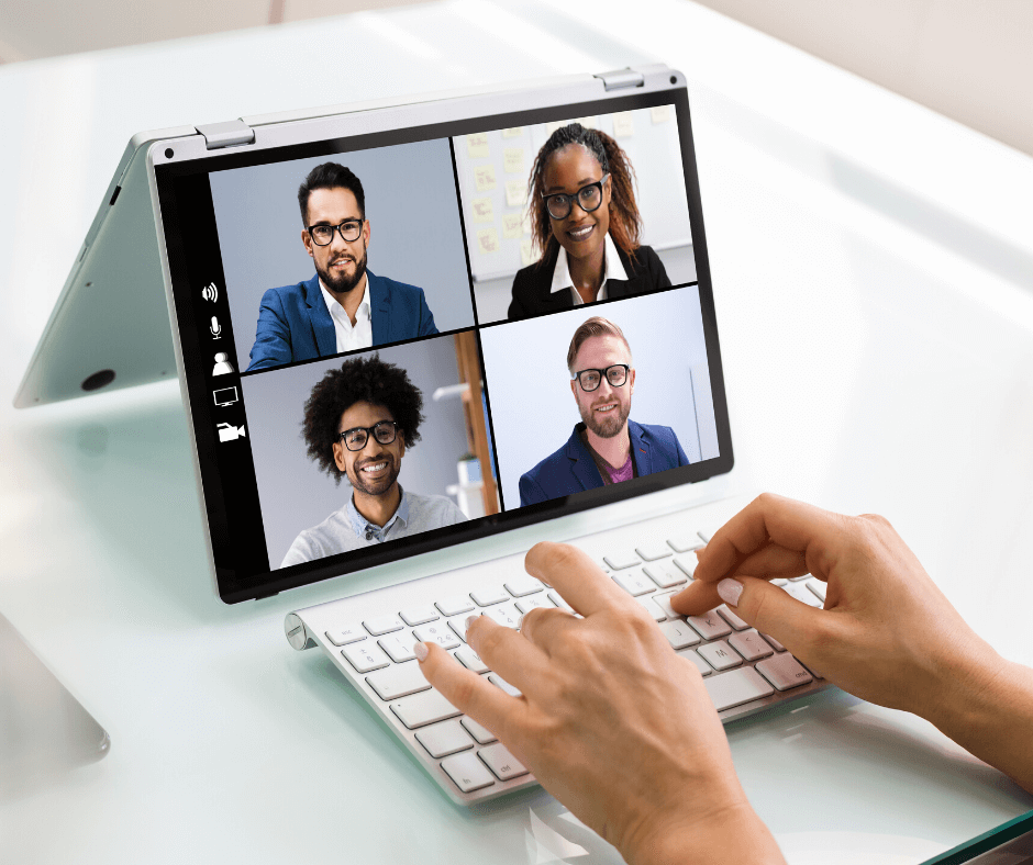 Candidate sitting at home with their laptop while the interview panel join in from different locations