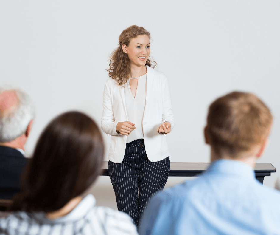 Lady delivering a presentation to her team