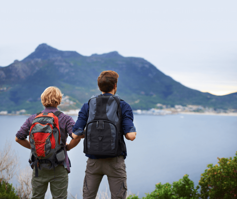 Couple admiring the view from a high precipice