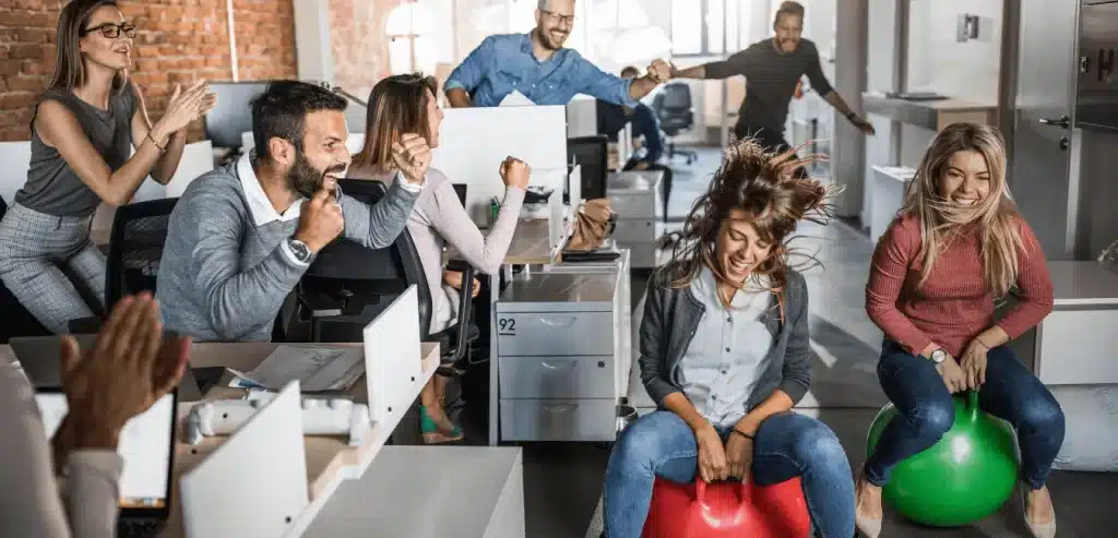 Job hopping on the job - employees racing through the office on space hoppers