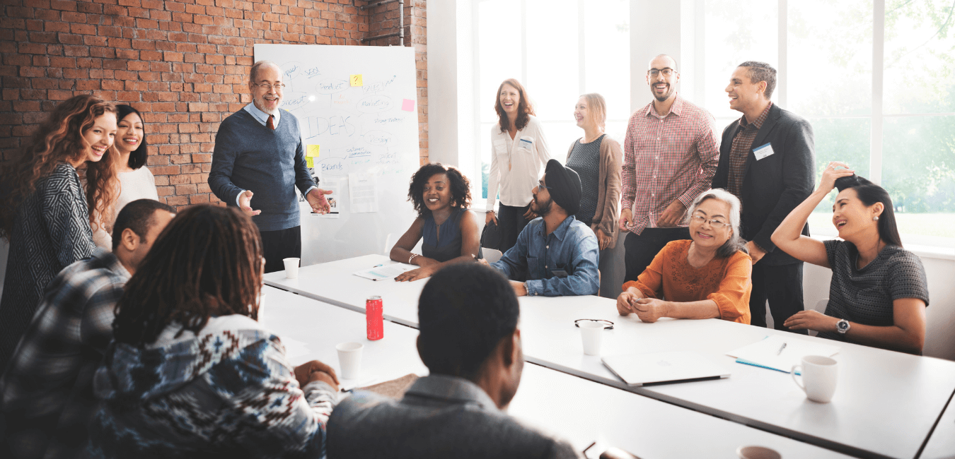 Employees sharing ideas around a table