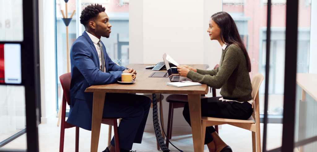 A black man is not worried as he's been interviewed by a woman, because he has prepared for his competency interview