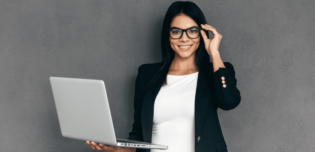 Young lady researching how to get into digital marketing on her laptop