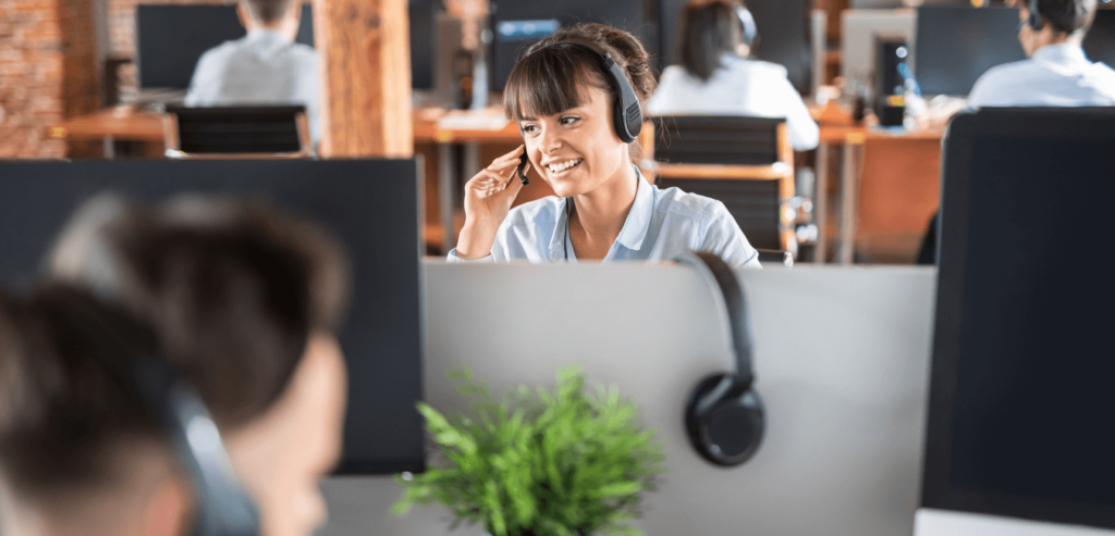 Lady making IT sales calls to customers using a headset