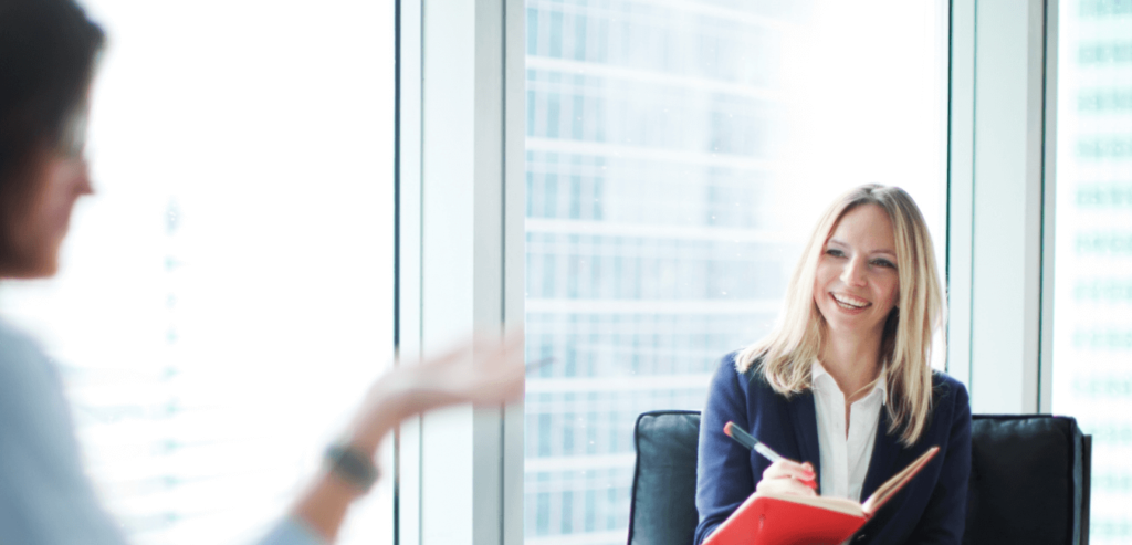 Recruitment consultant helping a candidate brush up on her interview skills.