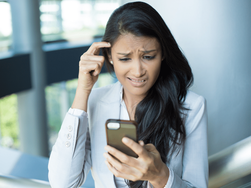 Interviewing for a job you don't want like this lady looking at her phone in confusion