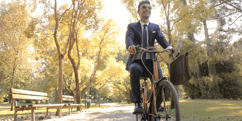 Business man cycling to work