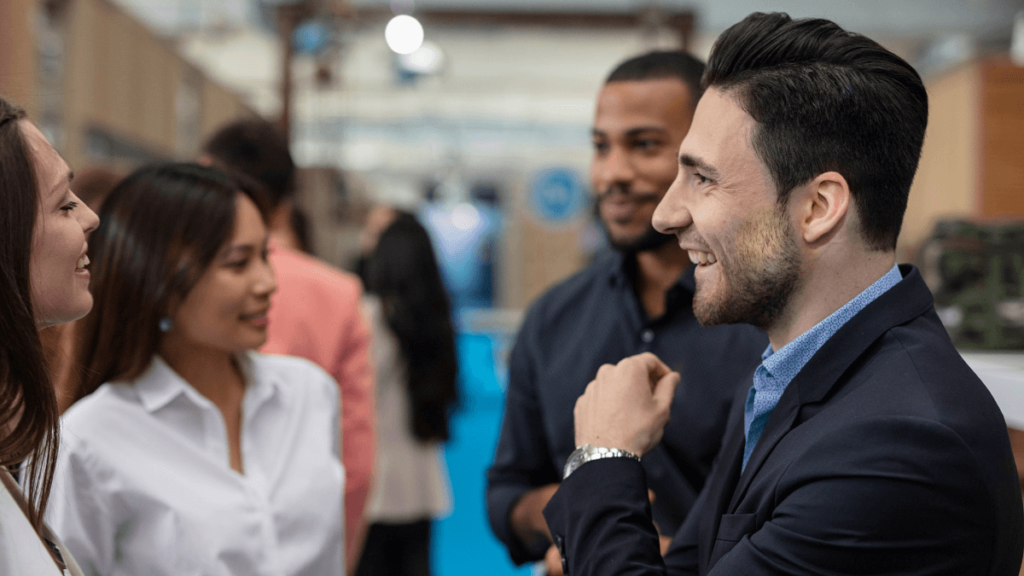 Professionals asking each other questions at a networking event