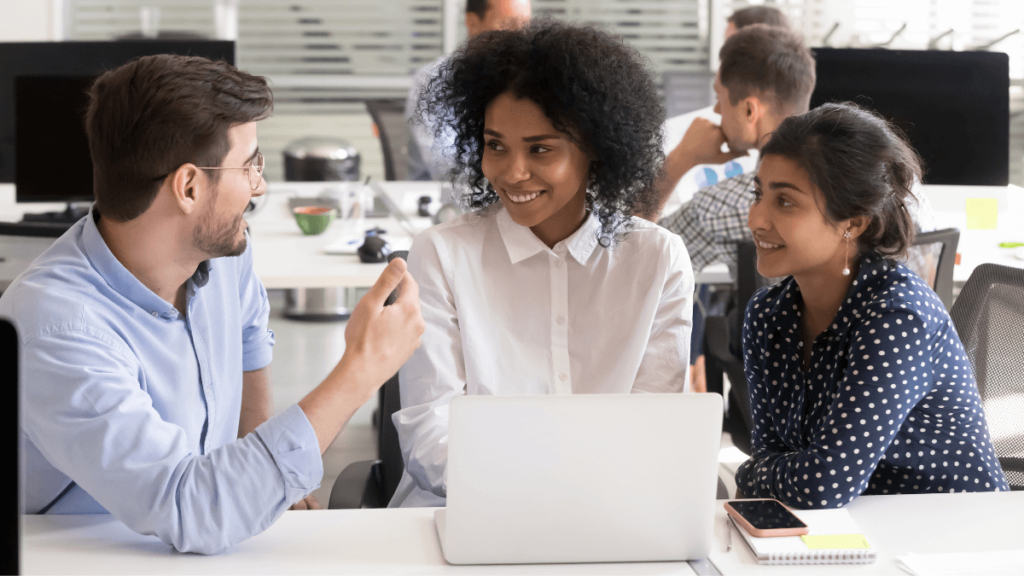 Employees with high emotional intelligence working together to solve a problem