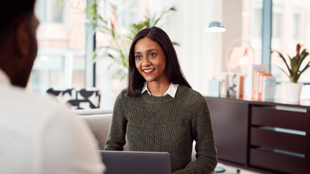 Young lady in a performance review meeting at work