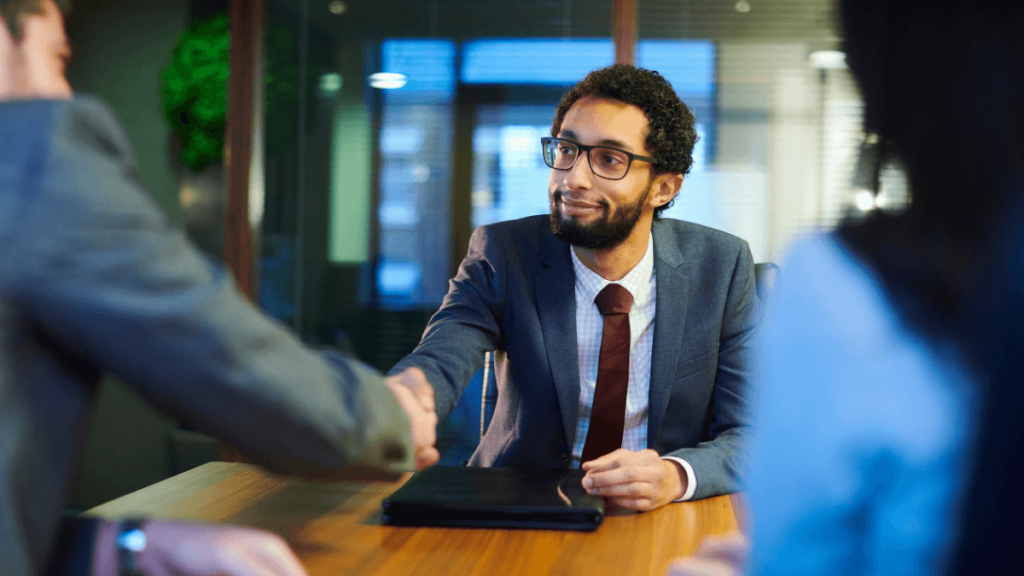 Man shaking the interviewer's hand following a successful job interview