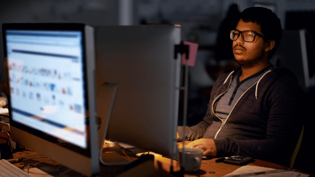 Man working long hours while IT contracting