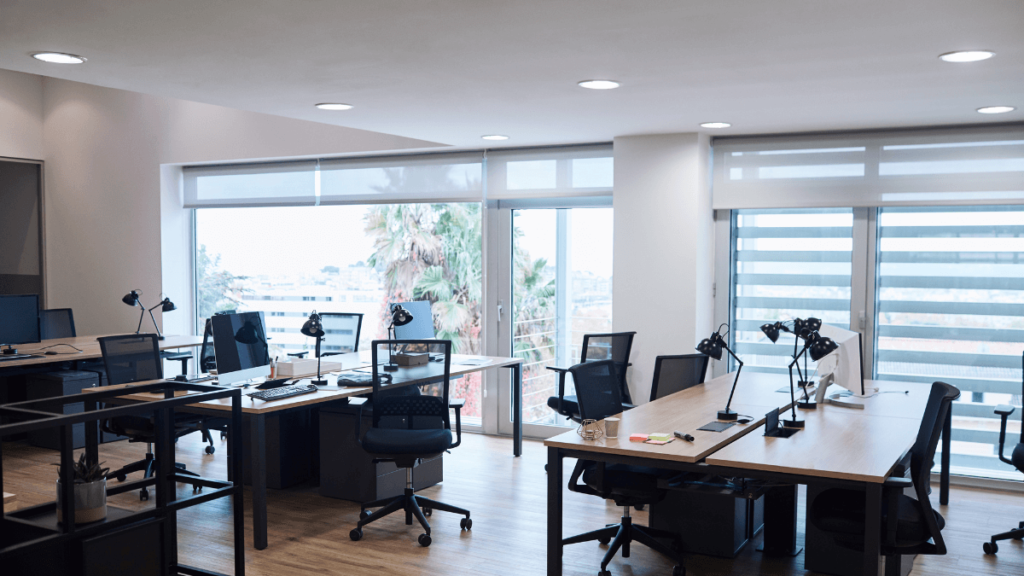 Empty desks wonder how to tempt employees back to the office