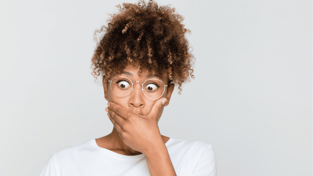 Interviewee looks in shock with her hand over her mouth and wide eyes