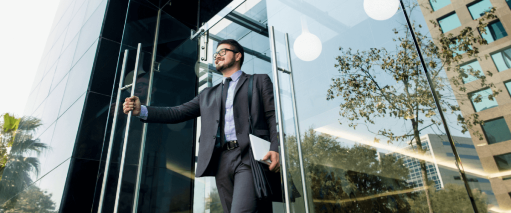 Man smiling as he leaves work for the final time