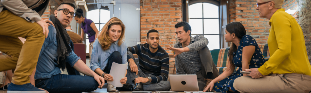 Team of PPC executives brainstorming ideas with their newly hired team member.