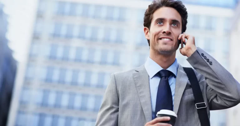 A mans talks over the phone to his recruiter to reschedule a job interview