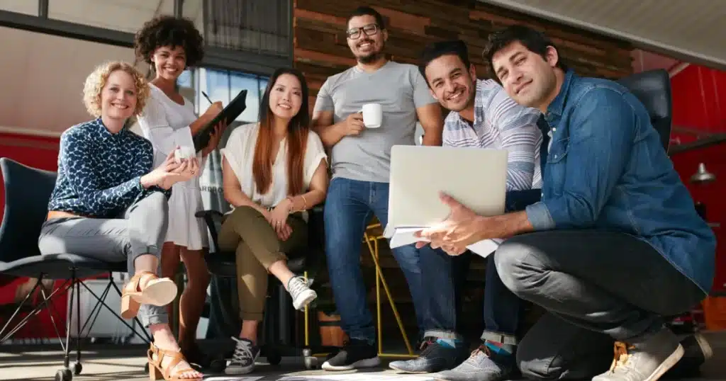 Different members of the marketing department of a company work together gathering testimonials to include in the employee success stories section of the careers website