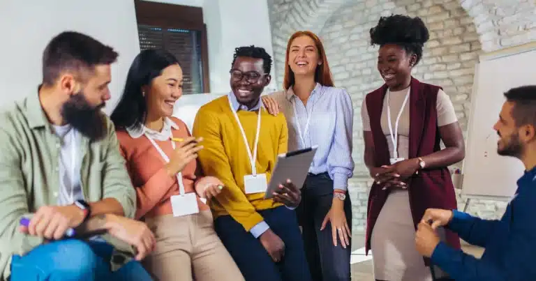 A diverse team of women and men chats friendly, happy to get involved in the company hiring process